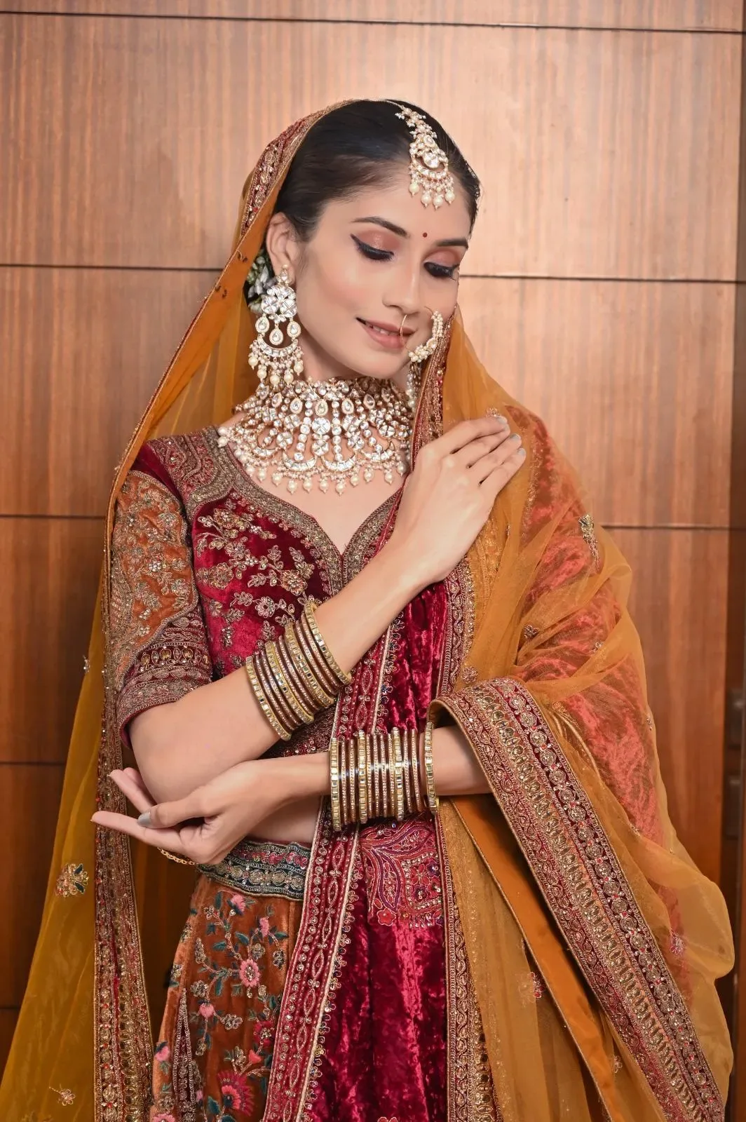Bridal look with rich traditional jewelry and warm-toned styling.