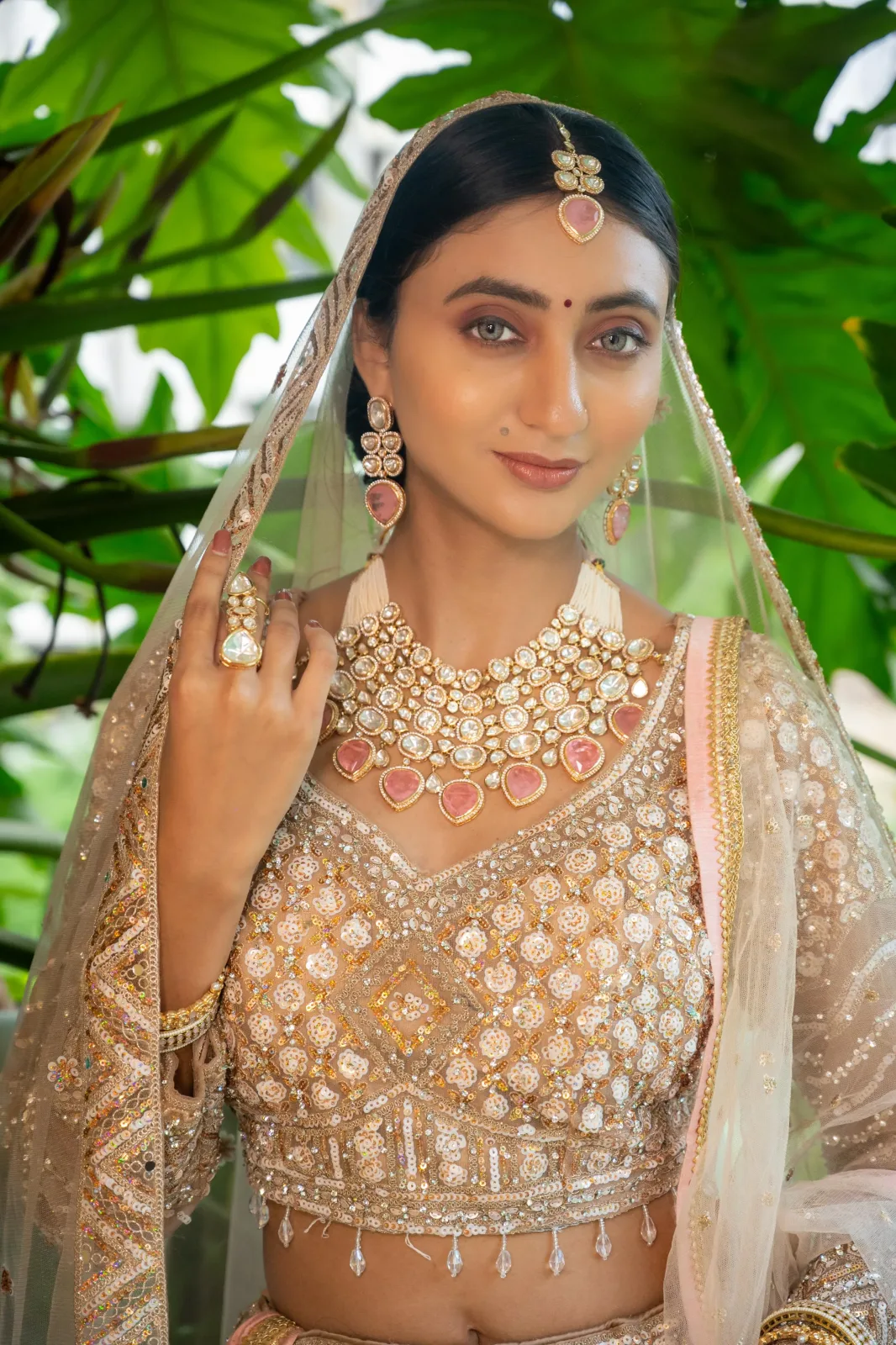 Elegant bridal portrait with soft glam makeup and statement earrings.