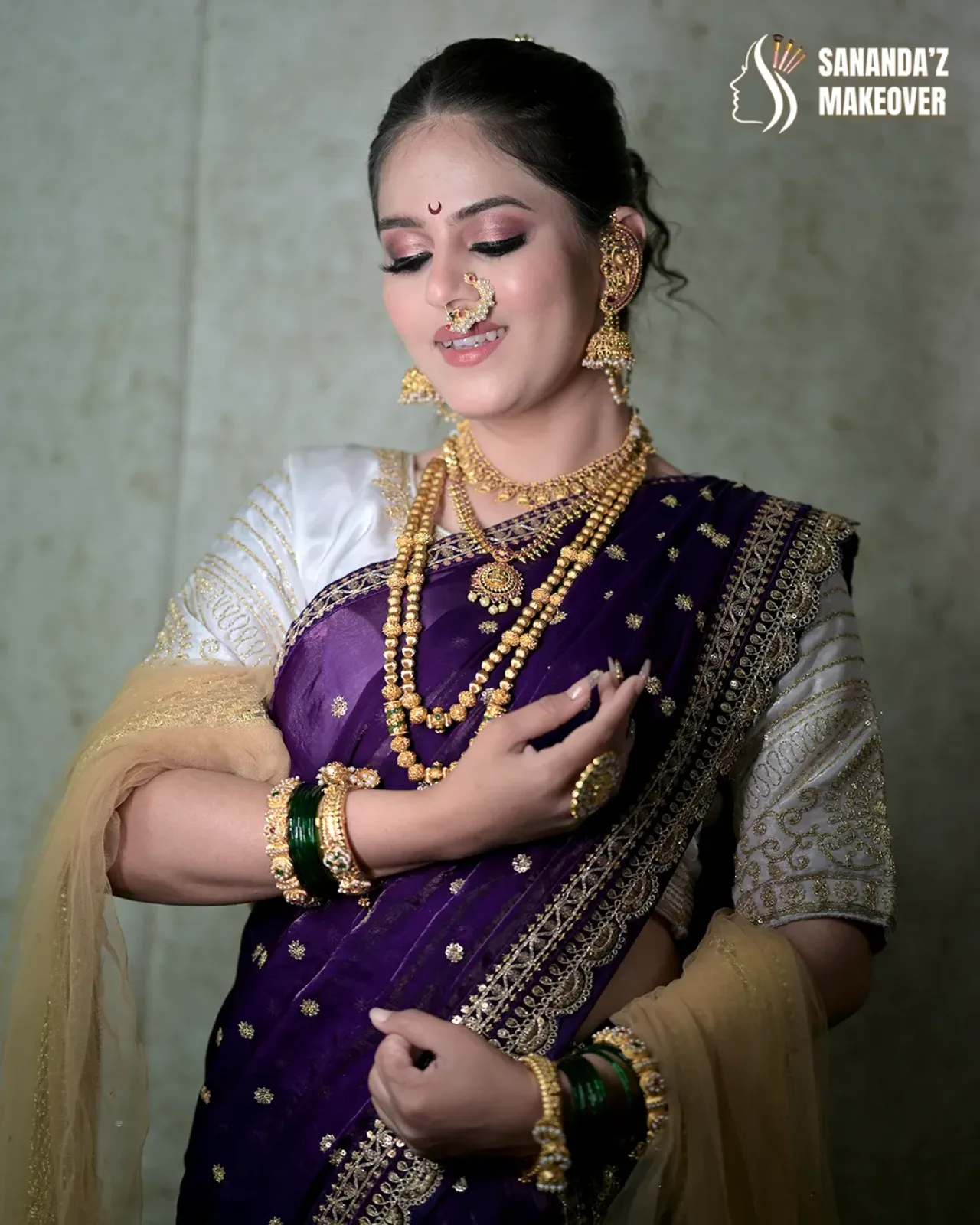 Detailed bridal makeup featuring luminous skin and expressive eyes.
